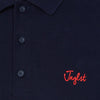 Navy Jnglst polo close up